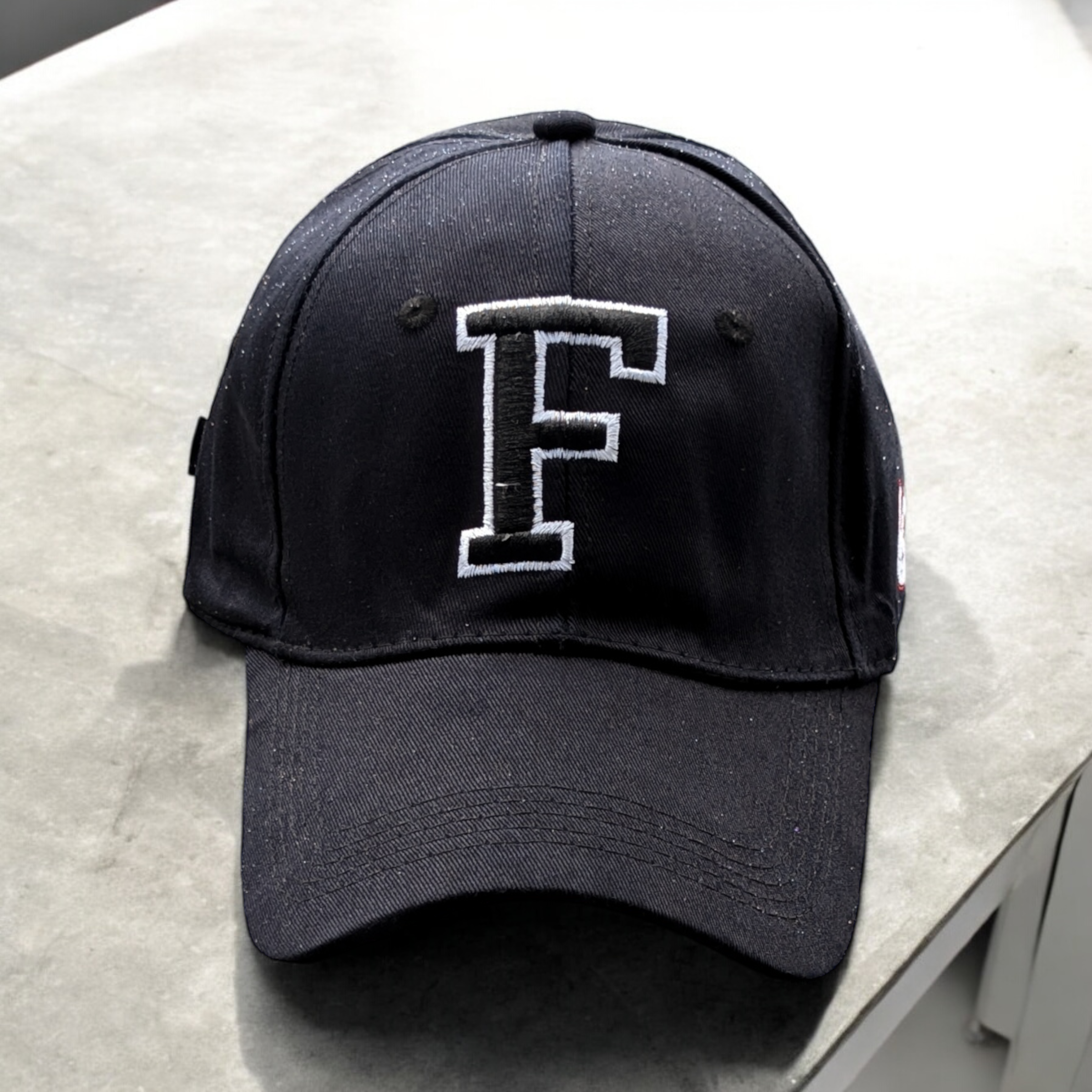 Cap [Letter F]